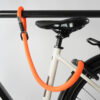 tex–lock mate in acid orange extends frame lock by securing bike to bike stand