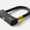 D-lock U-lock in black and yellow tex-lock design against a white background