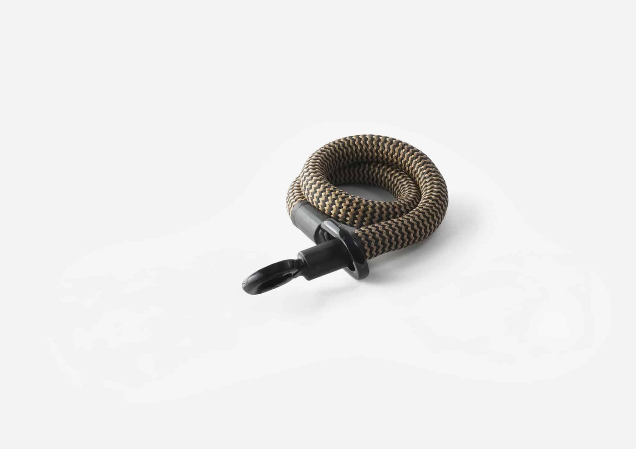 zwart-goud eyelet touw textielslot opgerold