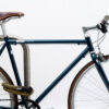 Colourful texlock orbit textile lock secures several bike parts to the bike stand